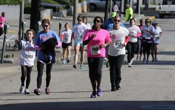 In April, Kameke Mitchell, chapter Young AFCEA Advisory Council member, crosses the finish line at the Walk of Life 5K.
